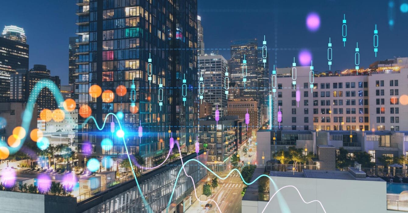 Malaysia Smart City Projects: A cityscape at night with overlayed colorful data and graph lines representing urban analytics.