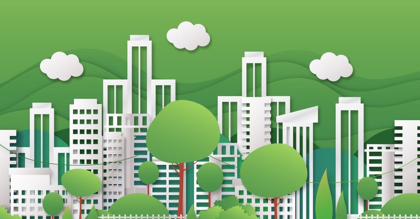 Malaysia Green Building Certifications: A vibrant green cityscape featuring modern buildings and lush trees against a hilly backdrop with white clouds in a paper cut style.